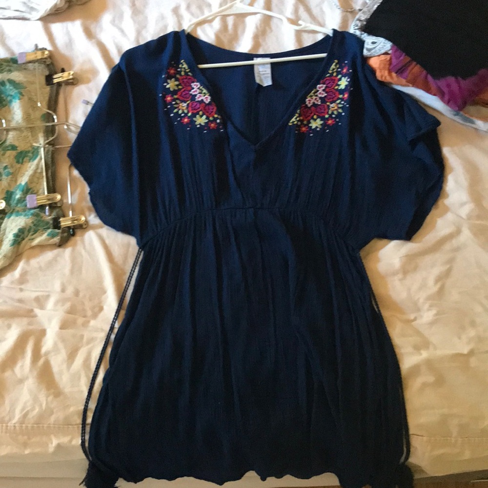 Navy blue blue dress with a flower accent